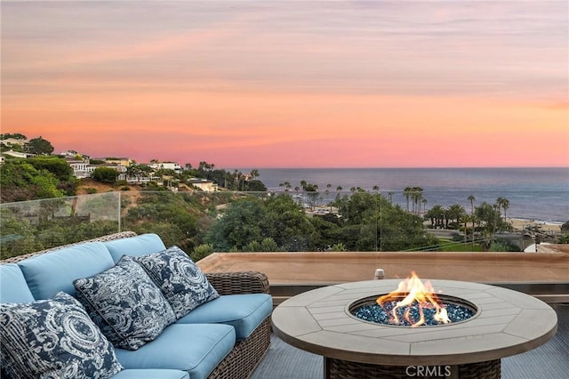 21732 Wesley Dr Unit 6, Laguna Beach, CA 92651 - view of patio / terrace with a water view and an outdoor living space with a fire pit