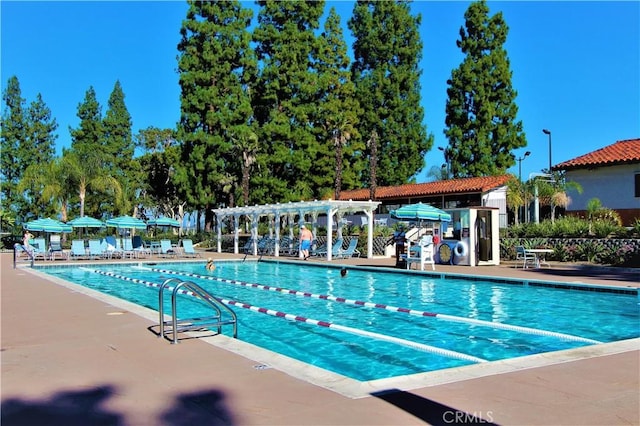 pool featuring a patio area and a pergola