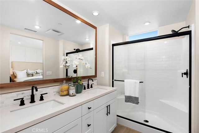 1810 E 1st St Unit 130, Santa Ana, CA 92705 - ensuite bathroom with a shower stall, double vanity, and recessed lighting