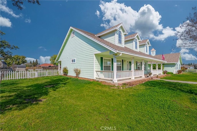 view of side of home featuring a porch, a yard, fence, and roof with shingles