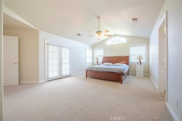 carpeted bedroom featuring visible vents, baseboards, a ceiling fan, and vaulted ceiling