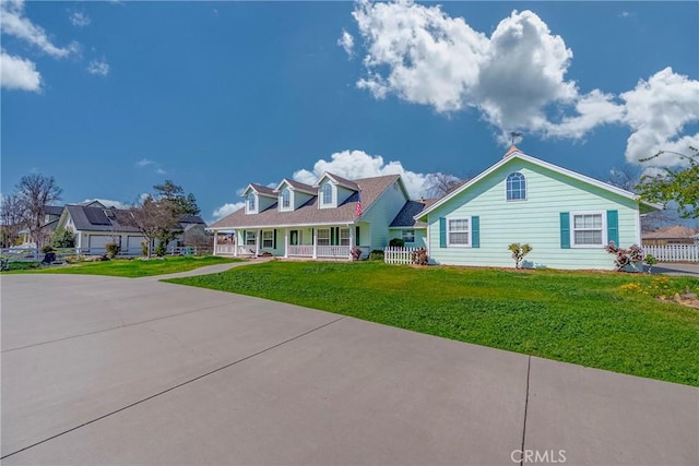 cape cod home featuring a porch, fence, and a front yard