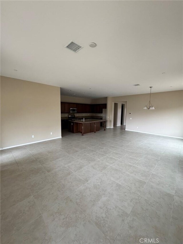 1572 Humboldt Peak, Beaumont, CA 92223 - unfurnished living room with baseboards