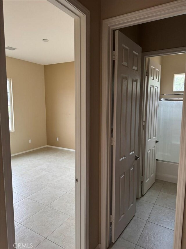1572 Humboldt Peak, Beaumont, CA 92223 - hallway with light tile patterned flooring and baseboards