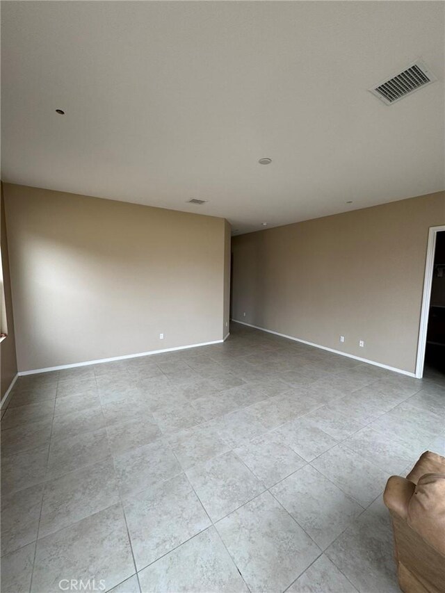 1572 Humboldt Peak, Beaumont, CA 92223 - tiled spare room with baseboards