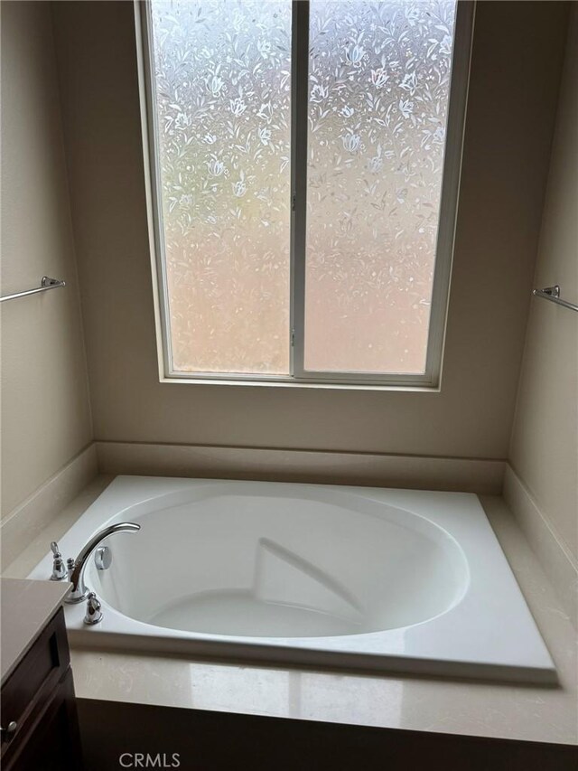 1572 Humboldt Peak, Beaumont, CA 92223 - full bathroom featuring a garden tub and vanity