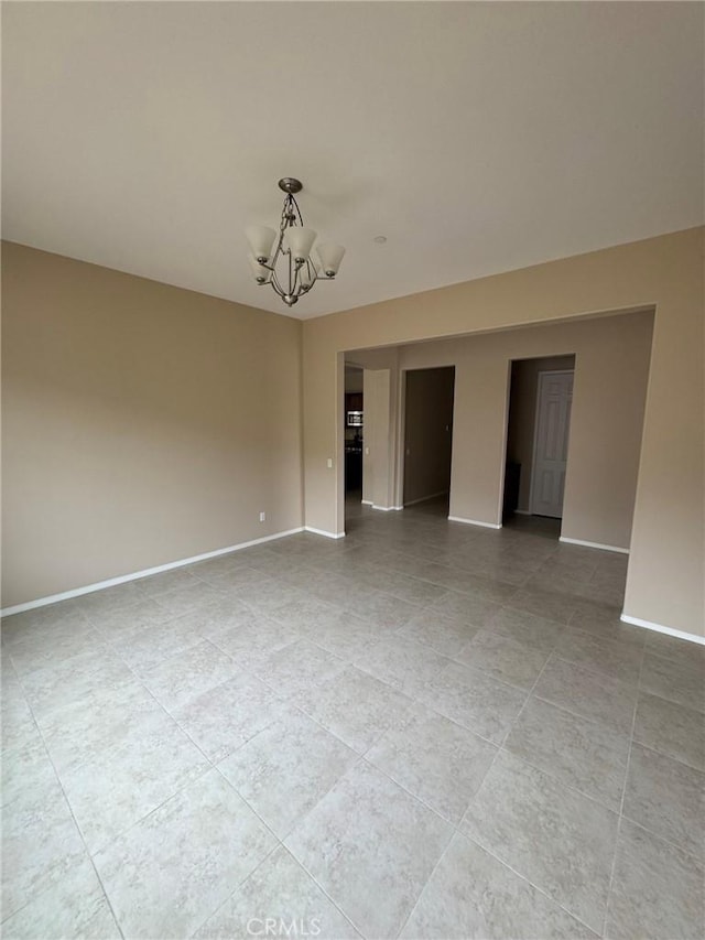 1572 Humboldt Peak, Beaumont, CA 92223 - spare room featuring a chandelier, baseboards, and light tile patterned floors