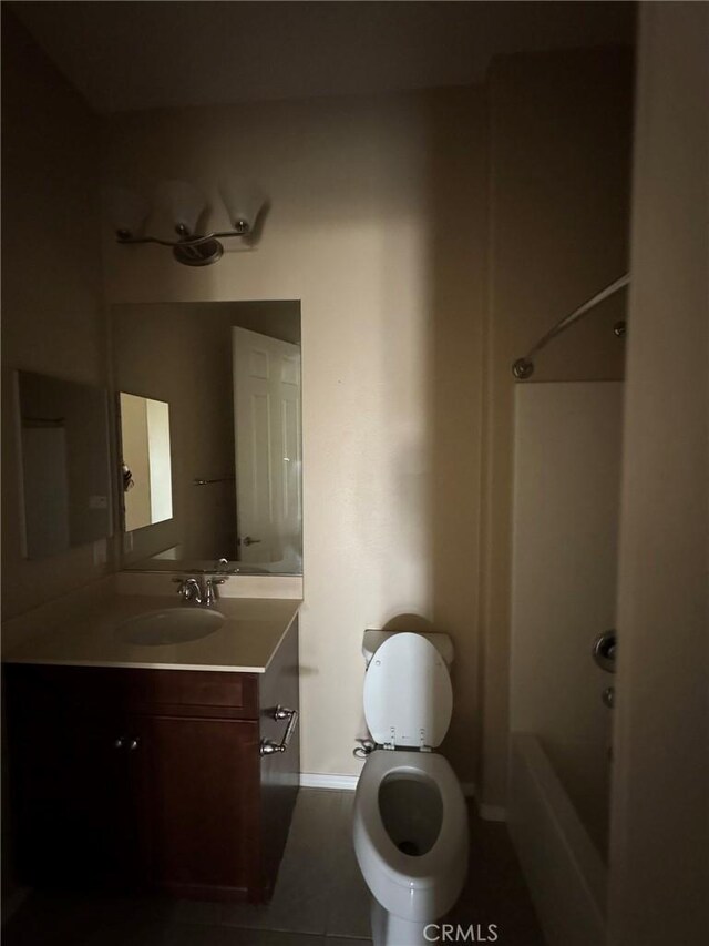 1572 Humboldt Peak, Beaumont, CA 92223 - bathroom with vanity, toilet, shower / bathtub combination, baseboards, and tile patterned flooring
