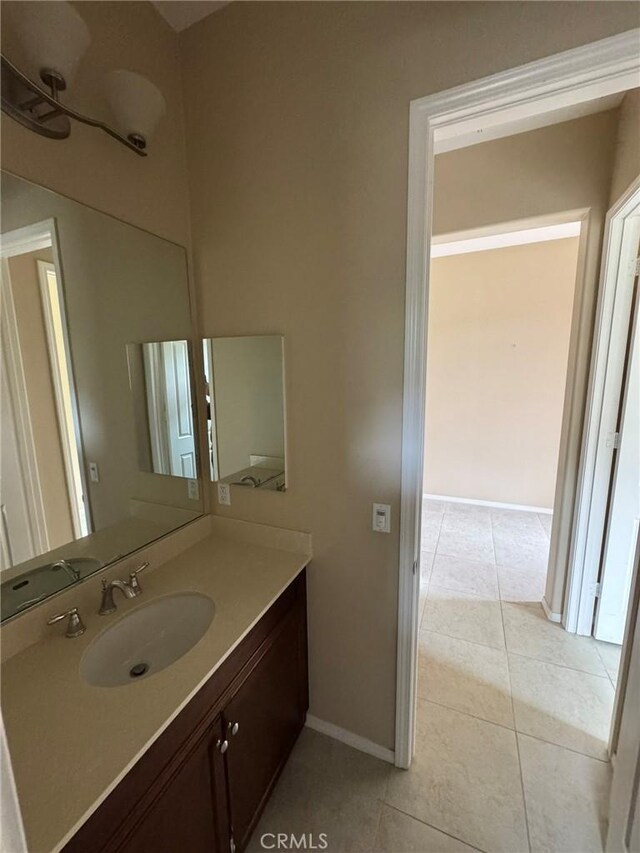 1572 Humboldt Peak, Beaumont, CA 92223 - bathroom featuring tile patterned flooring, vanity, and baseboards