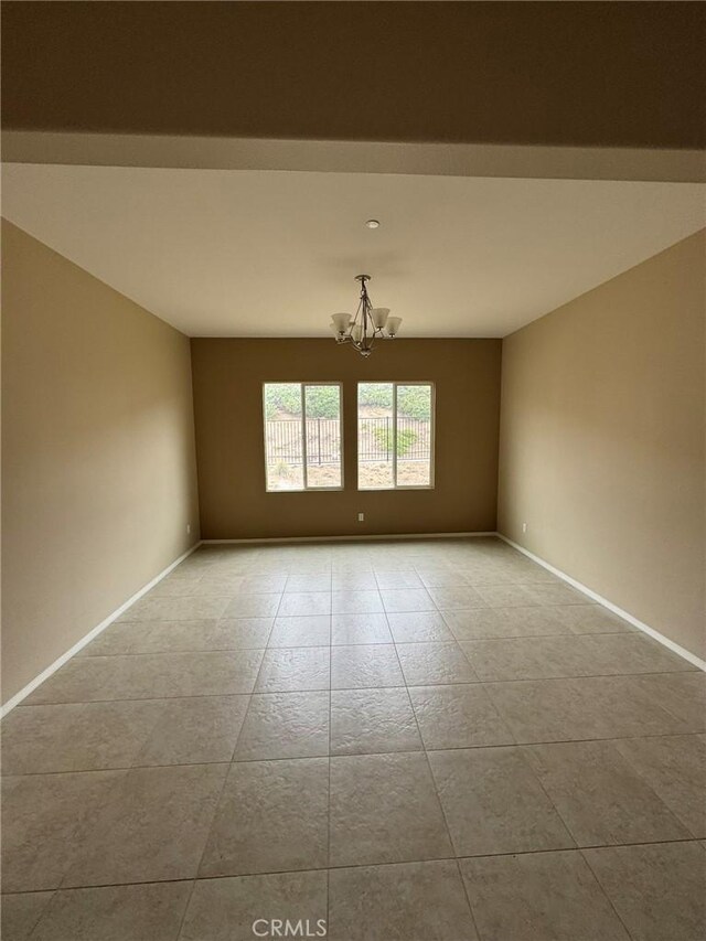 1572 Humboldt Peak, Beaumont, CA 92223 - tiled spare room with a chandelier and baseboards