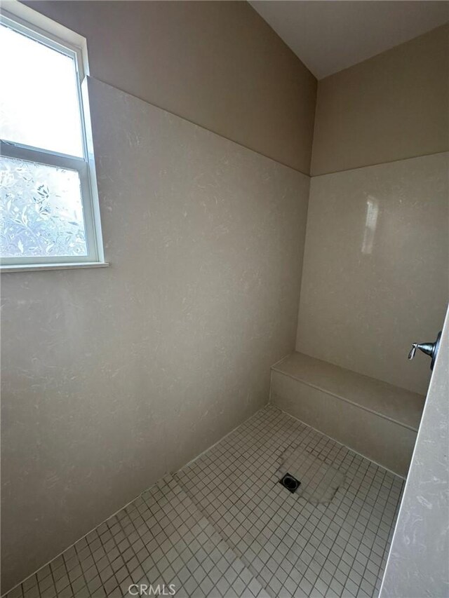 1572 Humboldt Peak, Beaumont, CA 92223 - bathroom featuring tiled shower and tile patterned flooring