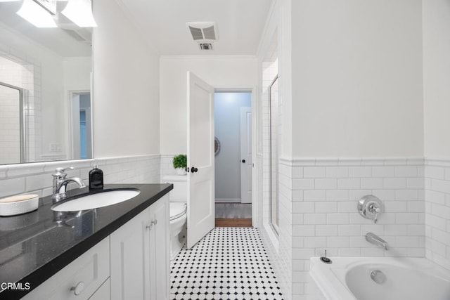 full bathroom featuring a bath, tile walls, and ornamental molding