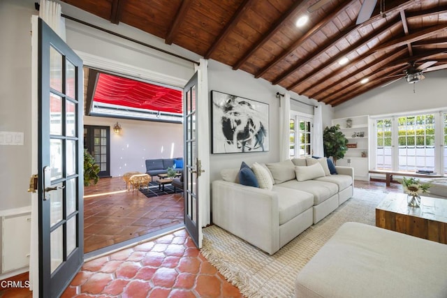 living area featuring french doors, vaulted ceiling with beams, wood ceiling, and a ceiling fan