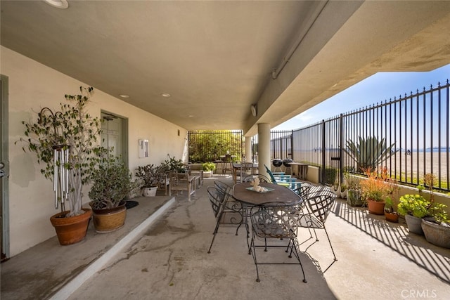 view of patio with fence and outdoor dining area