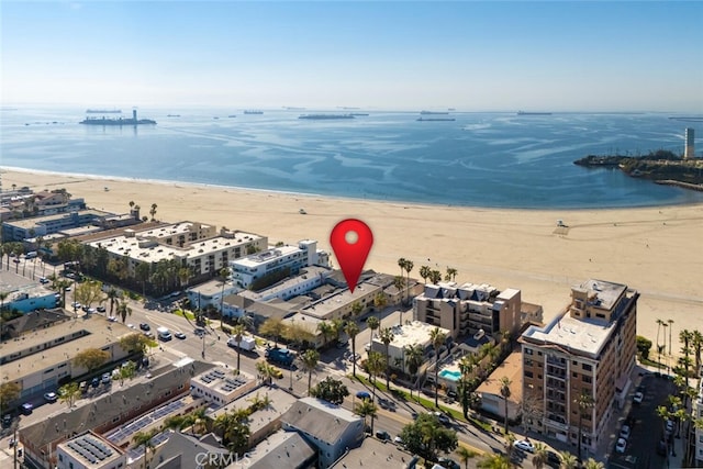 bird's eye view with a water view and a view of the beach