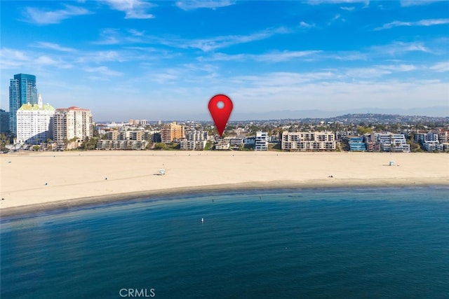 property view of water featuring a city view and a view of the beach