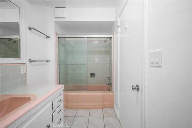 full bathroom with vanity, tile patterned flooring, backsplash, and enclosed tub / shower combo