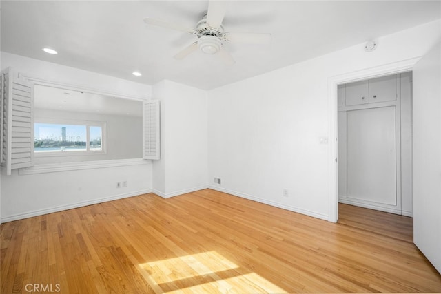 spare room with visible vents, wood finished floors, baseboards, ceiling fan, and recessed lighting