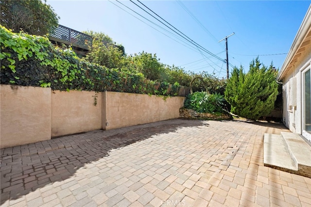 view of patio / terrace featuring fence