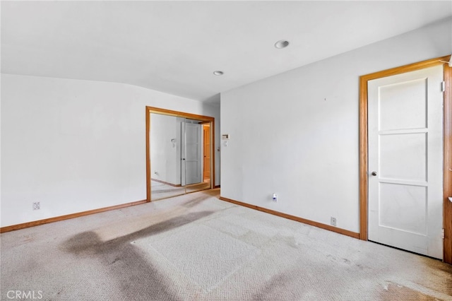 spare room with carpet flooring and baseboards