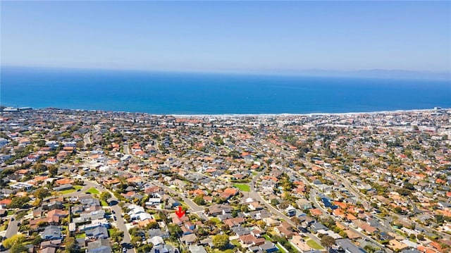 drone / aerial view featuring a water view and a residential view