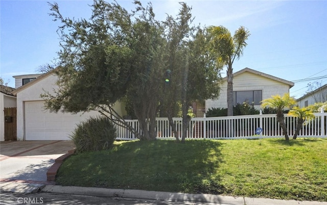 view of front of house featuring a fenced front yard, a front lawn, concrete driveway, and an attached garage