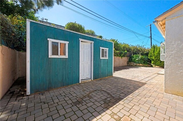 view of outbuilding with an outbuilding and a fenced backyard