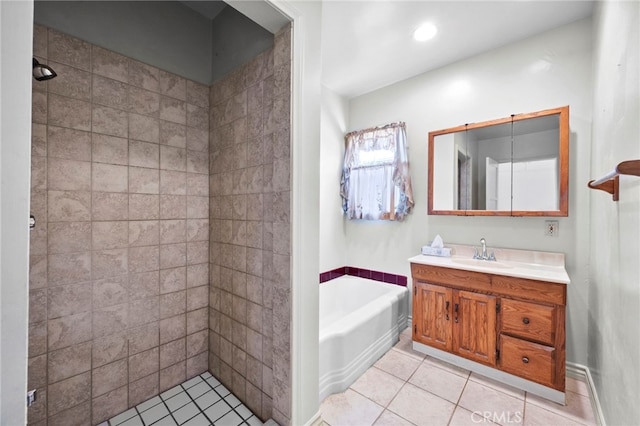 full bath featuring tile patterned flooring, a tile shower, vanity, and a garden tub