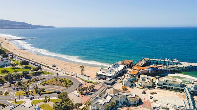 birds eye view of property featuring a water view and a view of the beach