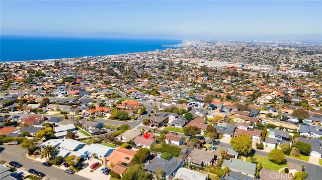 drone / aerial view with a residential view and a water view