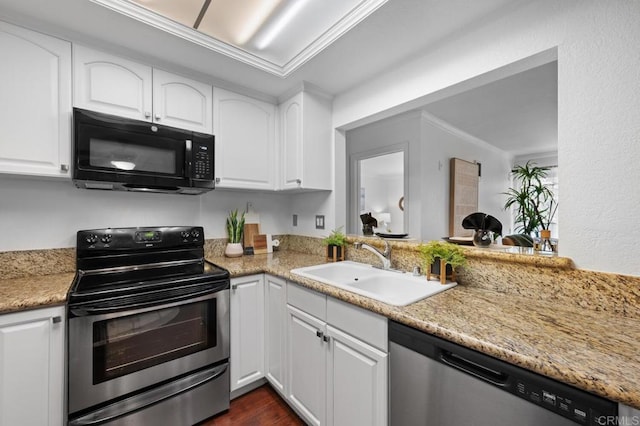 kitchen featuring a sink, ornamental molding, dark wood-type flooring, stainless steel appliances, and white cabinetry