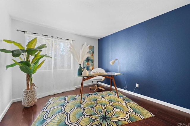 office featuring baseboards and wood finished floors