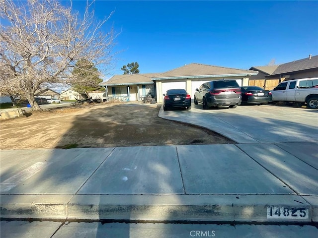 single story home with an attached garage and driveway