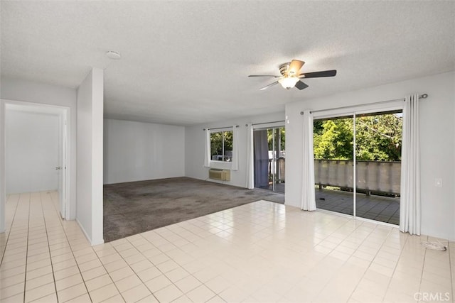 2405 Via Mariposa W Unit 2G, Laguna Woods, CA 92637 - carpeted spare room featuring a ceiling fan, tile patterned flooring, a textured ceiling, and cooling unit