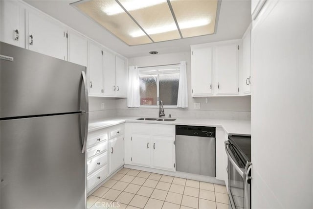 2405 Via Mariposa W Unit 2G, Laguna Woods, CA 92637 - kitchen featuring stainless steel appliances, white cabinets, light tile patterned floors, and light countertops