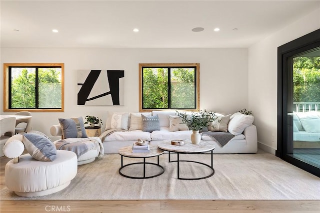 living room with recessed lighting and wood finished floors
