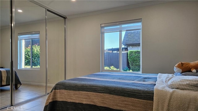 8166 Laguna Ct, Stanton, CA 90680 - bedroom with crown molding, light tile patterned flooring, baseboards, and recessed lighting