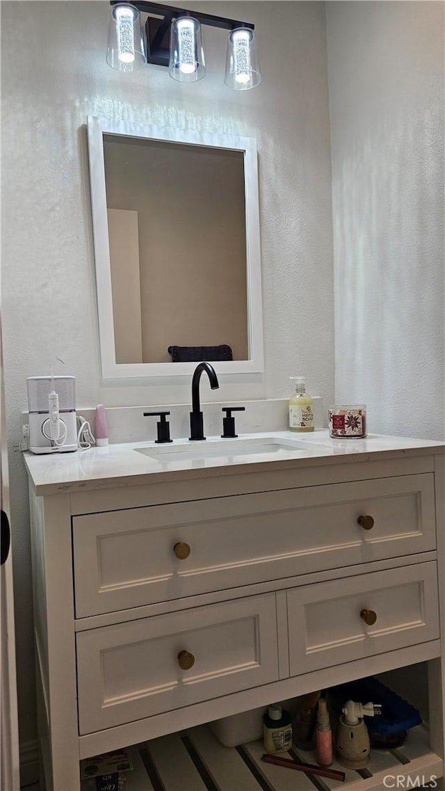 8166 Laguna Ct, Stanton, CA 90680 - bathroom with a textured wall and vanity