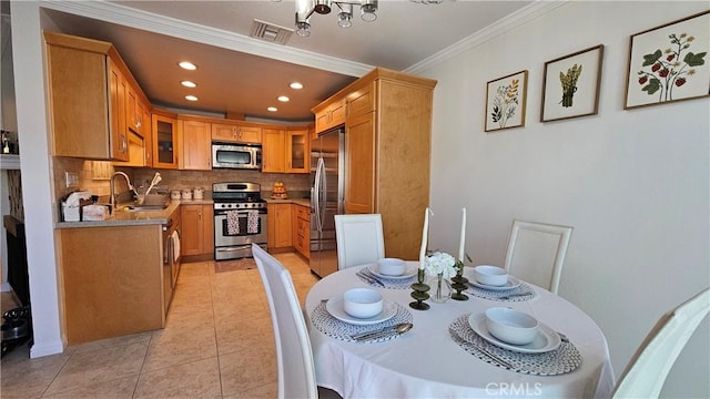 8166 Laguna Ct, Stanton, CA 90680 - dining space featuring light tile patterned floors, ornamental molding, visible vents, and recessed lighting
