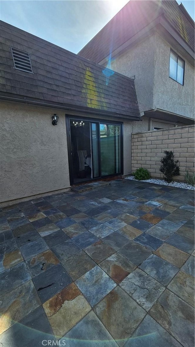 8166 Laguna Ct, Stanton, CA 90680 - entrance to property featuring a patio area, stucco siding, and a shingled roof