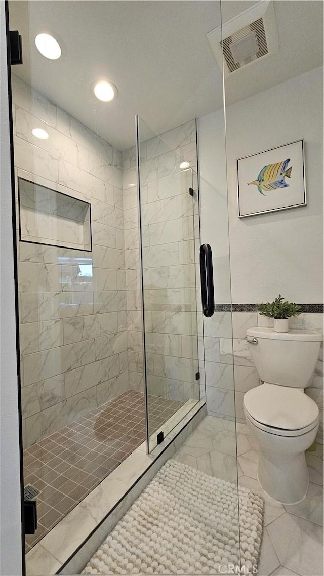 8166 Laguna Ct, Stanton, CA 90680 - bathroom with tiled shower, visible vents, marble finish floor, and toilet