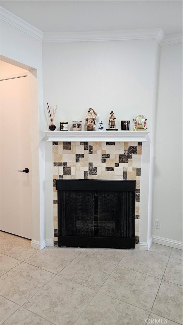 8166 Laguna Ct, Stanton, CA 90680 - interior details with a tiled fireplace, baseboards, and crown molding
