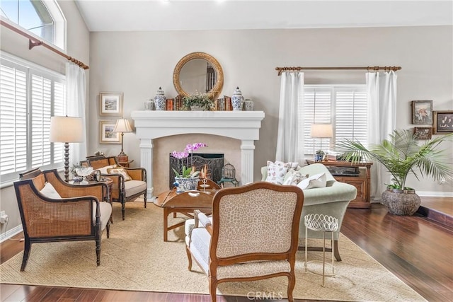 22432 Rosebriar, Mission Viejo, CA 92692 - living area with healthy amount of natural light, wood finished floors, and a lit fireplace