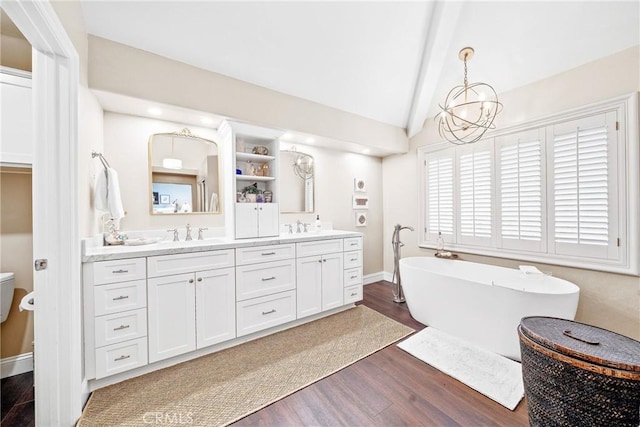 22432 Rosebriar, Mission Viejo, CA 92692 - bathroom with wood finished floors, double vanity, a freestanding bath, and a chandelier