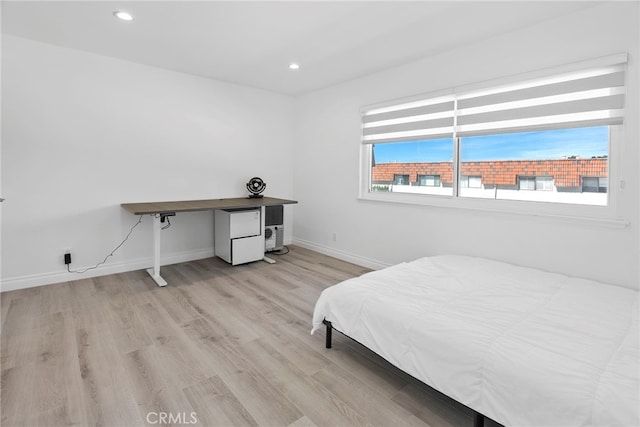 bedroom featuring light wood-style flooring, recessed lighting, and baseboards