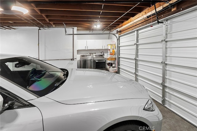 garage with washing machine and dryer