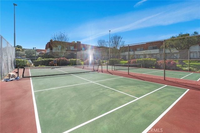 view of sport court featuring community basketball court and fence