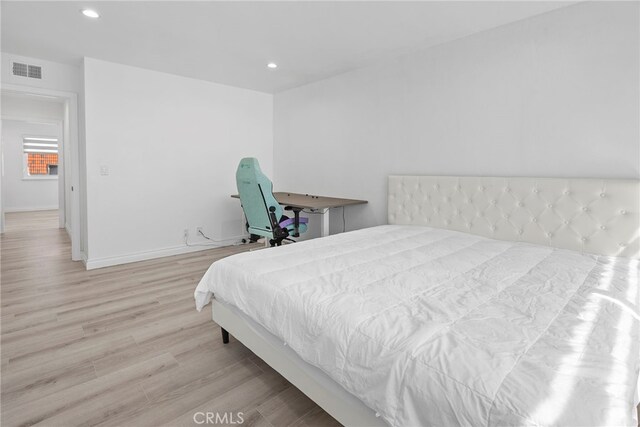 bedroom with recessed lighting, visible vents, baseboards, and light wood-style floors