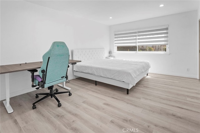 bedroom featuring recessed lighting, wood finished floors, and baseboards