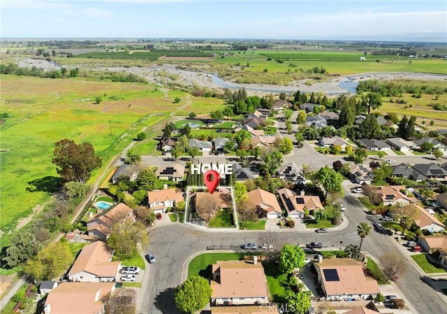drone / aerial view featuring a rural view and a residential view